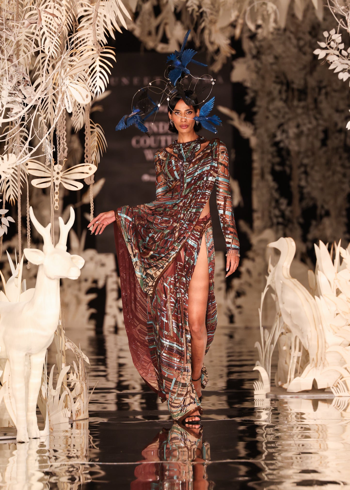 Abstract Printed Cape Gown with High Slit and Feathered Headpiece