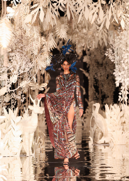 Abstract Printed Cape Gown with High Slit and Feathered Headpiece