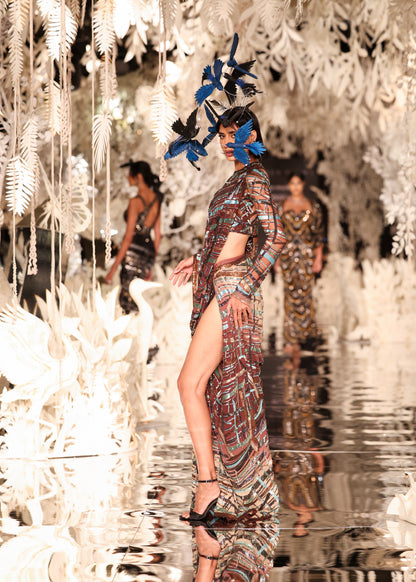 Abstract Printed Cape Gown with High Slit and Feathered Headpiece