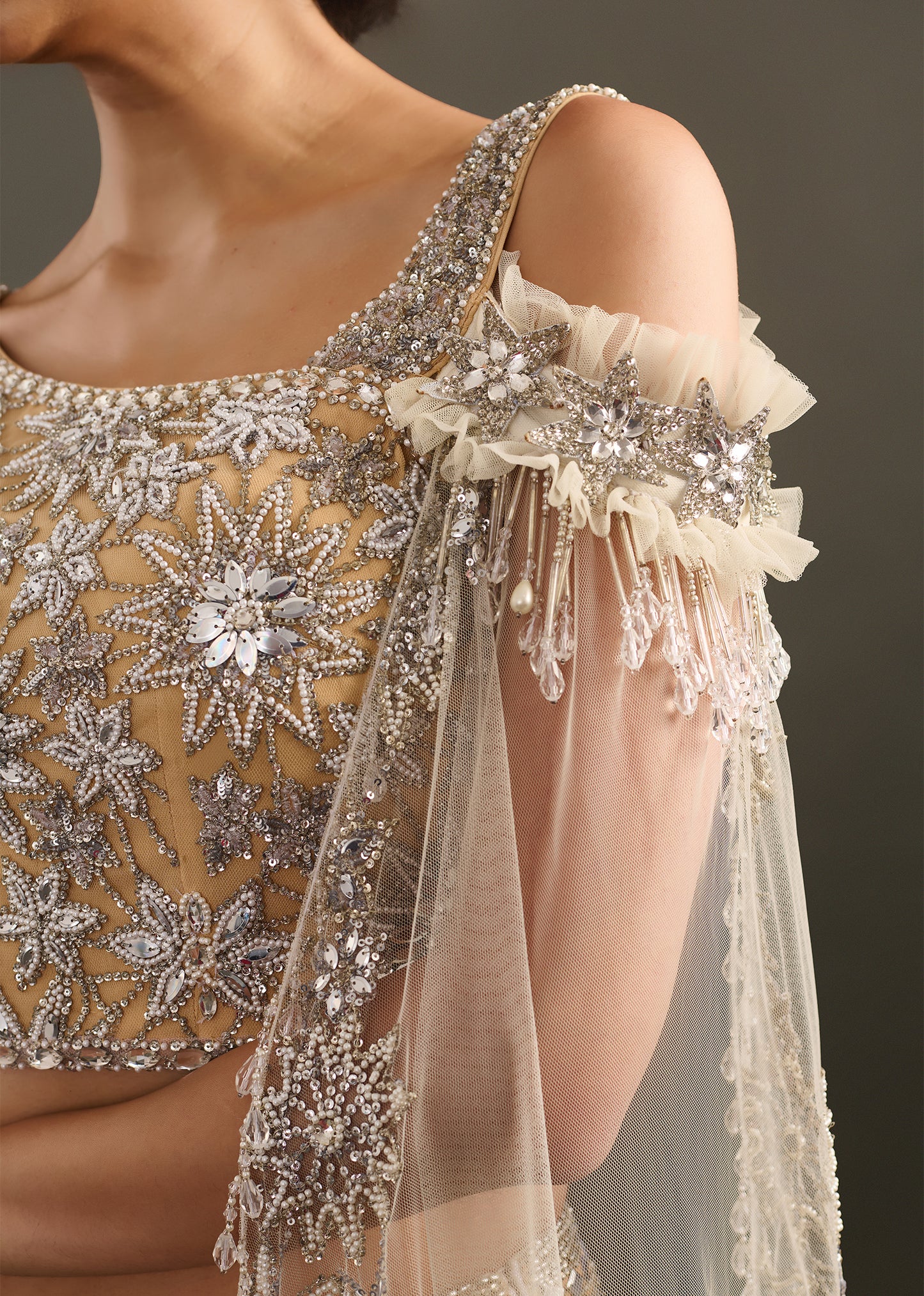 Gold-Toned Sequin and Beaded Lehenga with Asymmetrical Cape Blouse