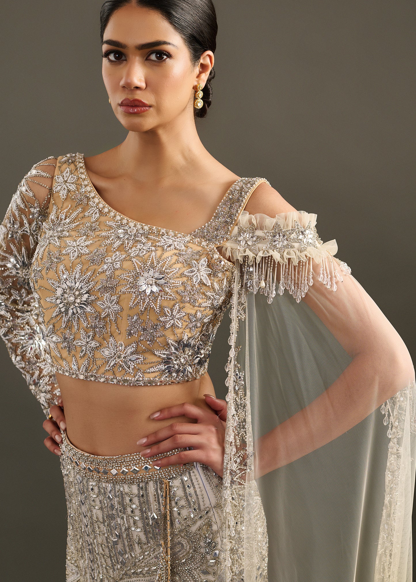 Gold-Toned Sequin and Beaded Lehenga with Asymmetrical Cape Blouse